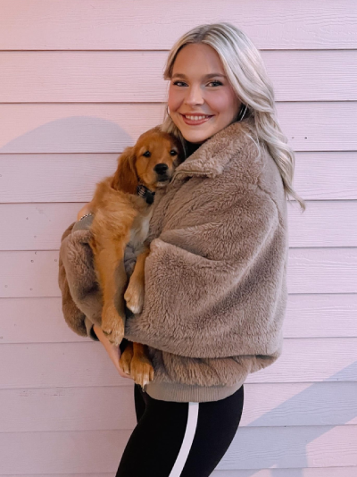 girl holding puppy